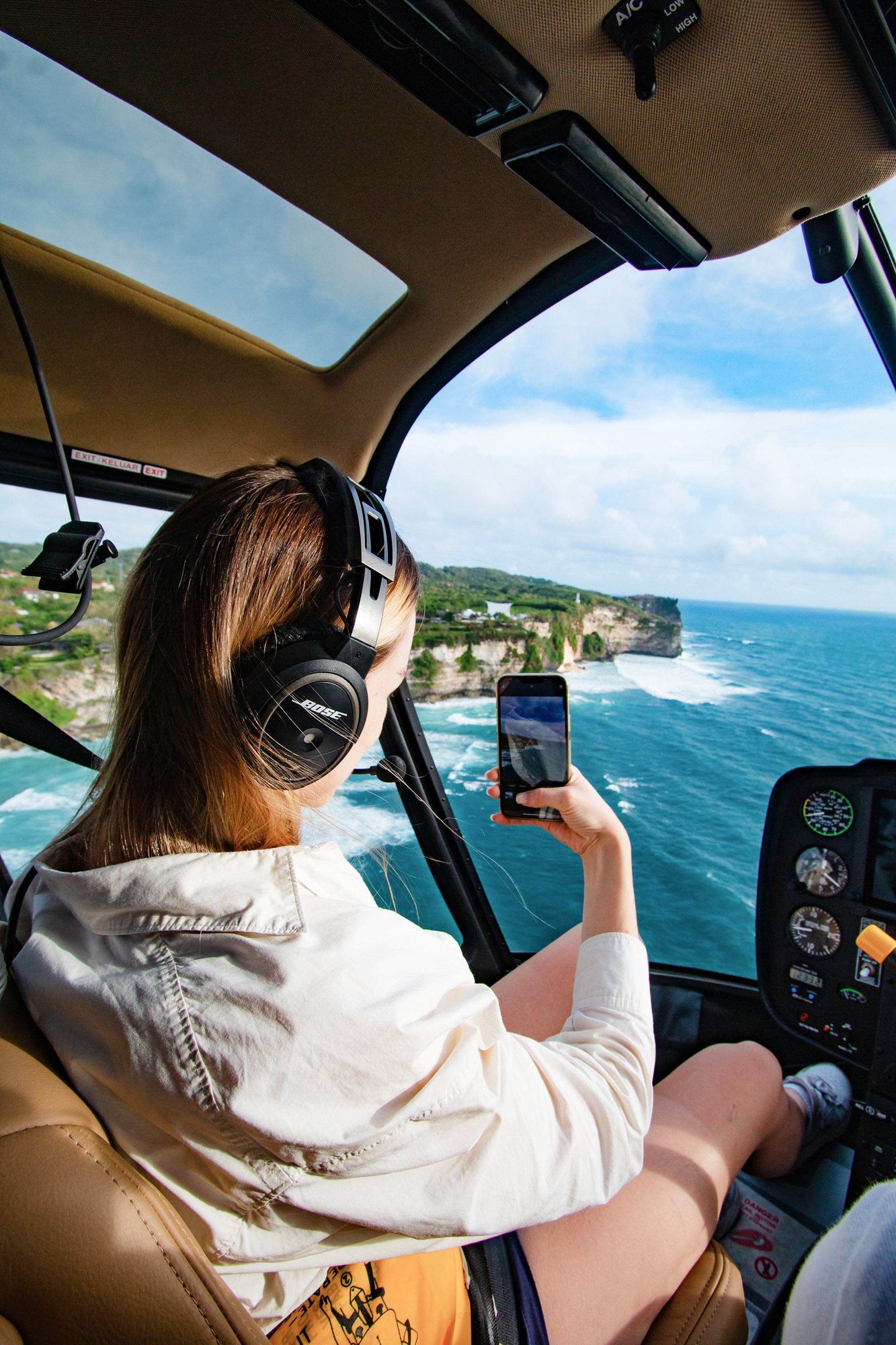 The Bali coastline seen from a helicopter cabin