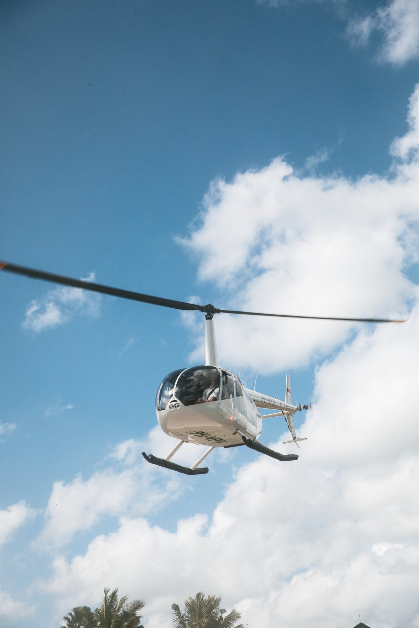 Robinson R66 lifting off